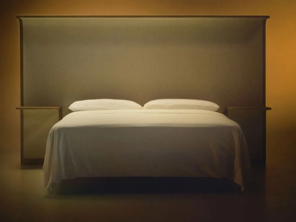 Courtoisie bed with wooden headboard and Bolzan Letti fabric.