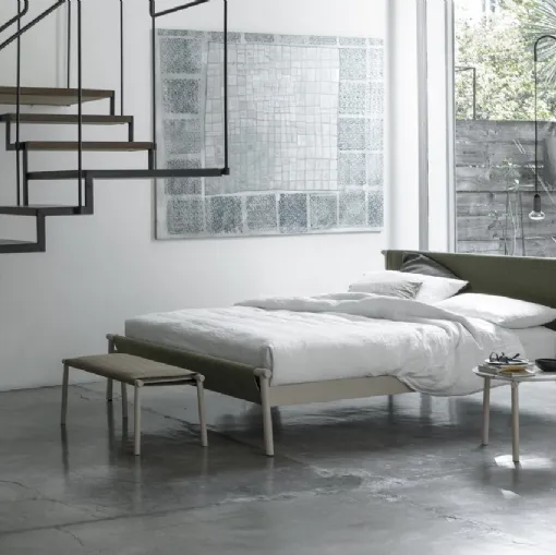 Bed with metal structure and fabric headboard Jack by Bolzan Letti.