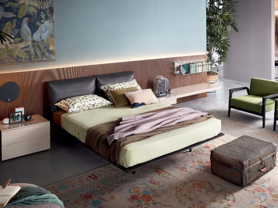 Double bed in leather with Mynight headboard by Lema.