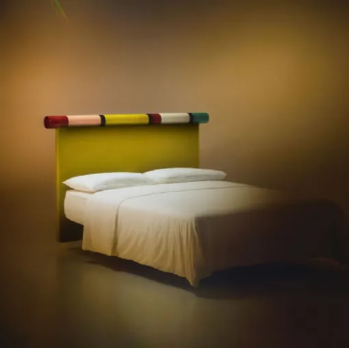 Bolzan Letti's Rosary bed with fabric headboard and glossy lacquered finish.
