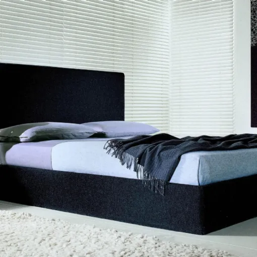 Double bed in upholstered fabric with headboard and Semillon storage box by Lema.