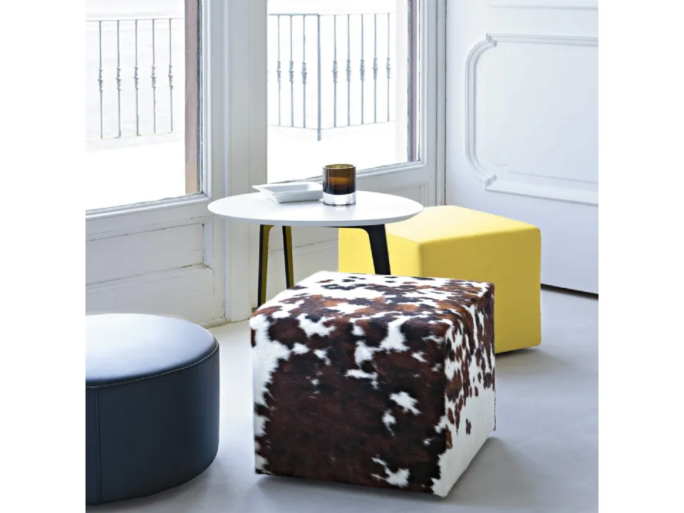 Square and round poufs in leather or fabric by Lema.