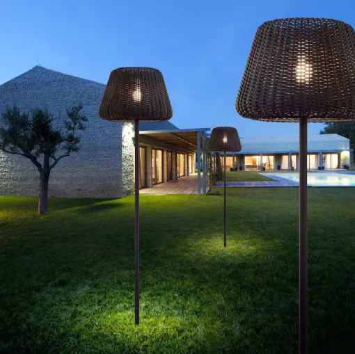 Ralph outdoor lamp in hand-woven synthetic rattan with transparent polycarbonate diffuser by Panzeri.