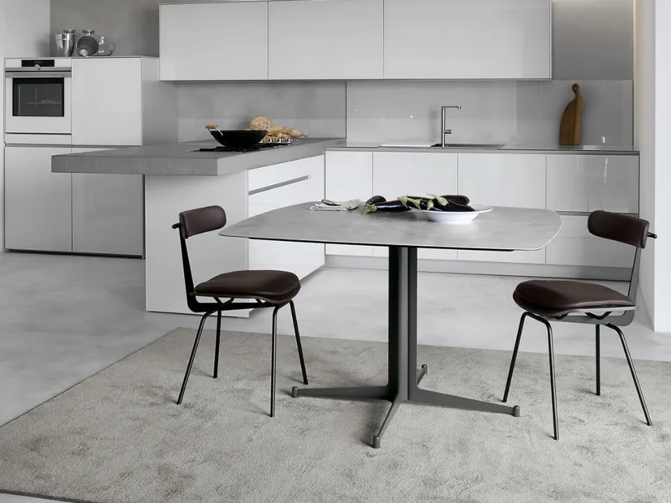 Table T9 configuration 03 with top in white lime concrete HPL and frame in cast steel by Extendo.