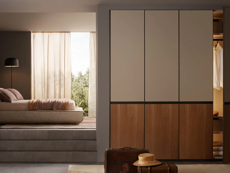 Lena wardrobe with hinged doors in lacquered and wood essence by Lema.